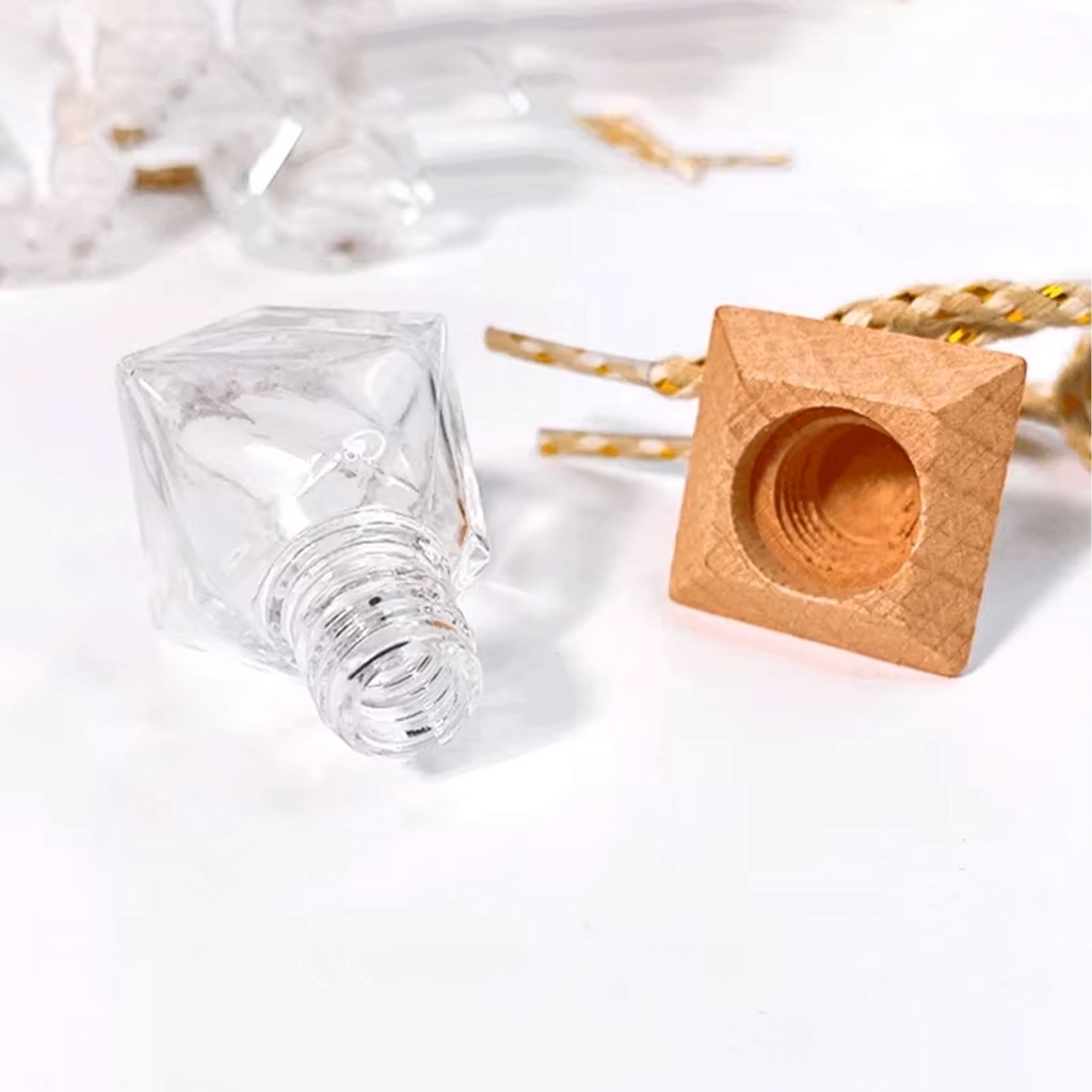 Wooden Triangular Gem-Shaped Lid with a Glass Perfume bottle. VR4234